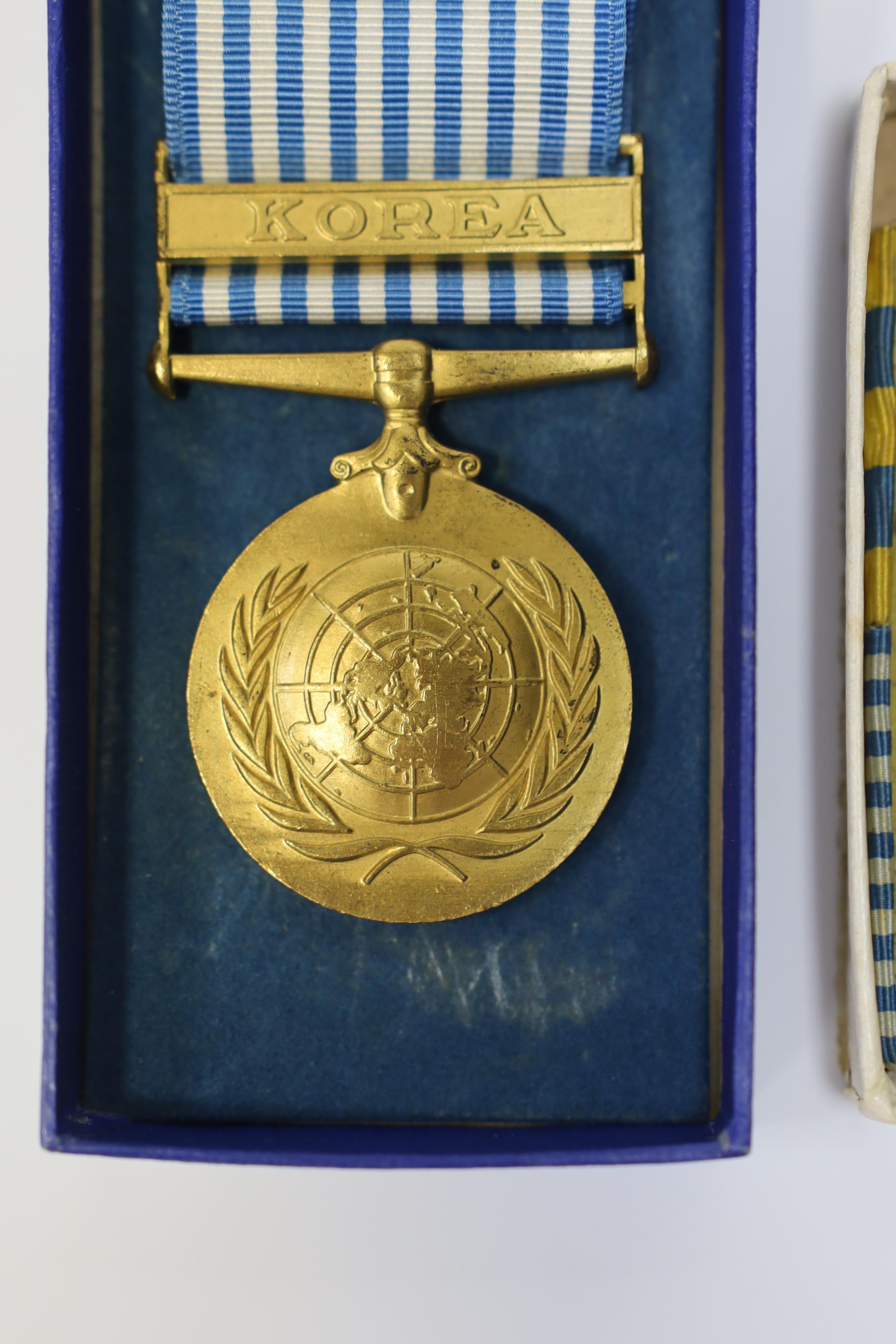 An ERII Operational Service Medal for Afghanistan awarded to Sgt. A.J. Pugsley RAMC (R), together with a Korea medal pair awarded to Sigmn. A.G. Lickman R.Sigs., all in separate issue boxes. Condition - fair to good